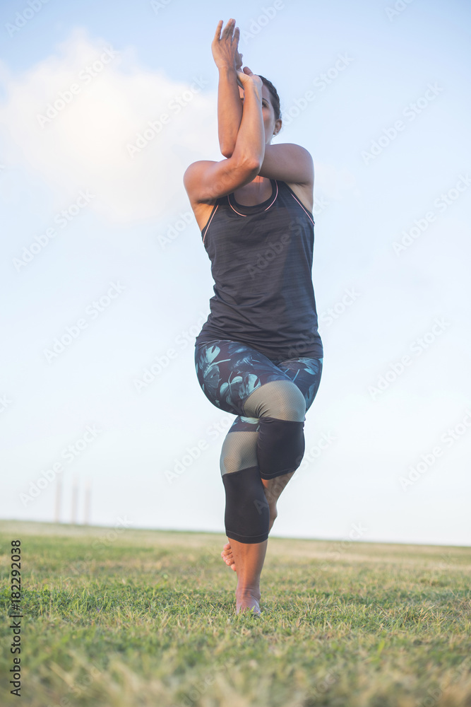 A Young woman doing yoga exercise outdoor A Young woman doing yoga exercise outdoor