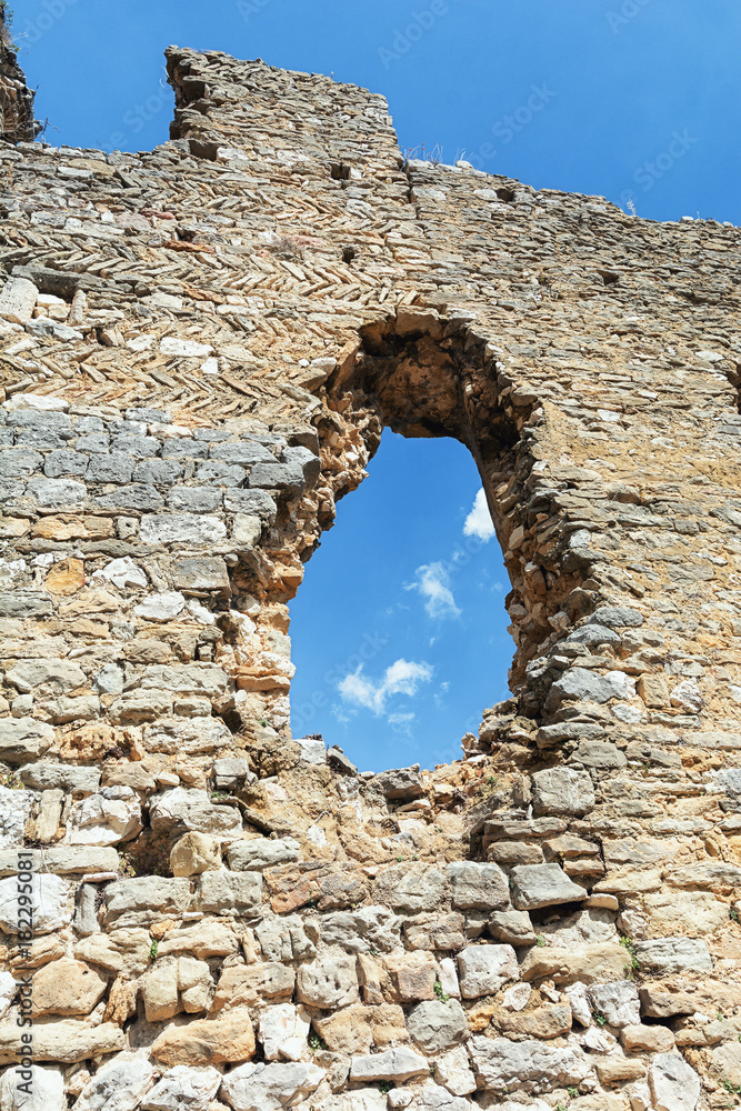 Hole in the wall of a ruin in the French village of Saint Montan