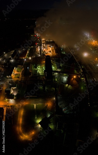 Aerial view of oil refinery. Industrial view at oil refinery plants with lots of light at night. Panorama. © nikwaller
