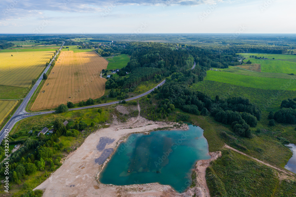Beautiful aerial view of blue lake in quarry. Amazing aerial view of many fields and meadows. Beautiful aerial view of blue lake in quarry. Amazing aerial view of many fields and meadows.