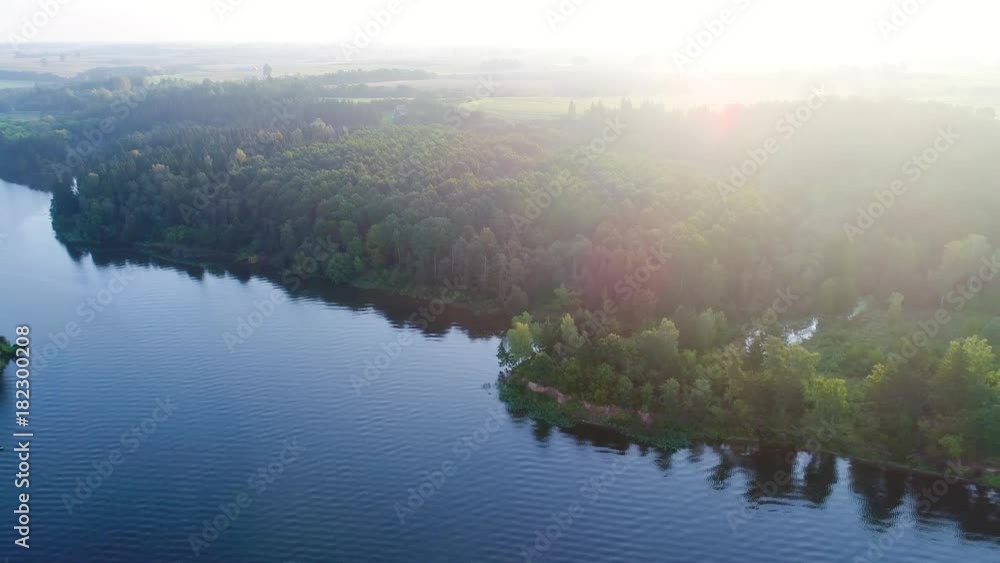 flying above foggy lake early in the morning flying above foggy lake early in the morning