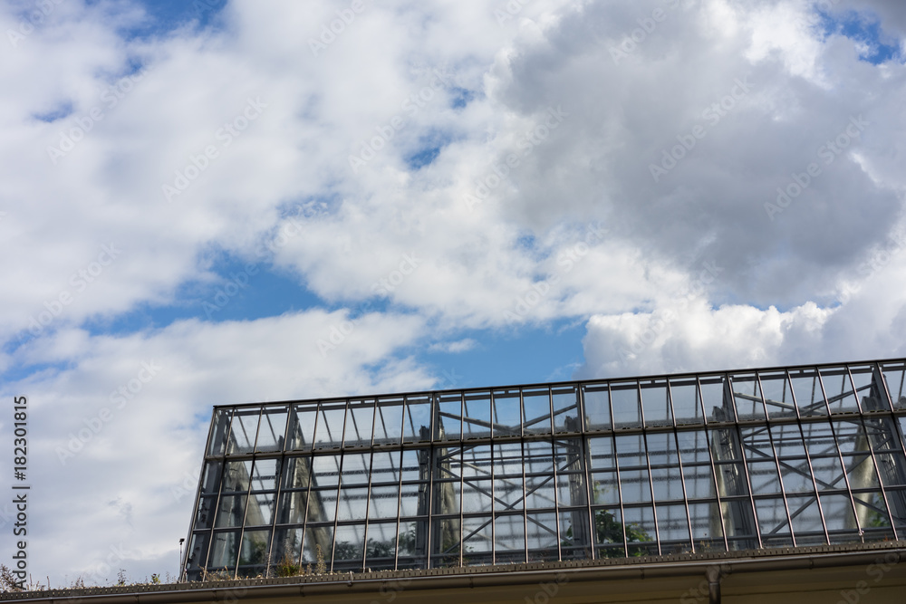 metal fence gate structure with cloudy sky