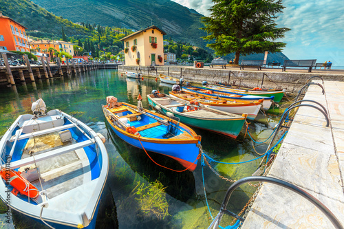 Colorful fishing boats on the Garda lake, Torbole, Italy, Europe