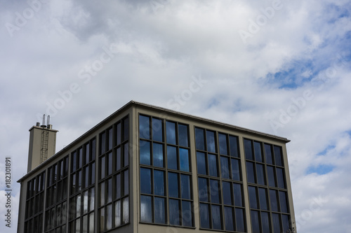 modern square building with cloudy sky