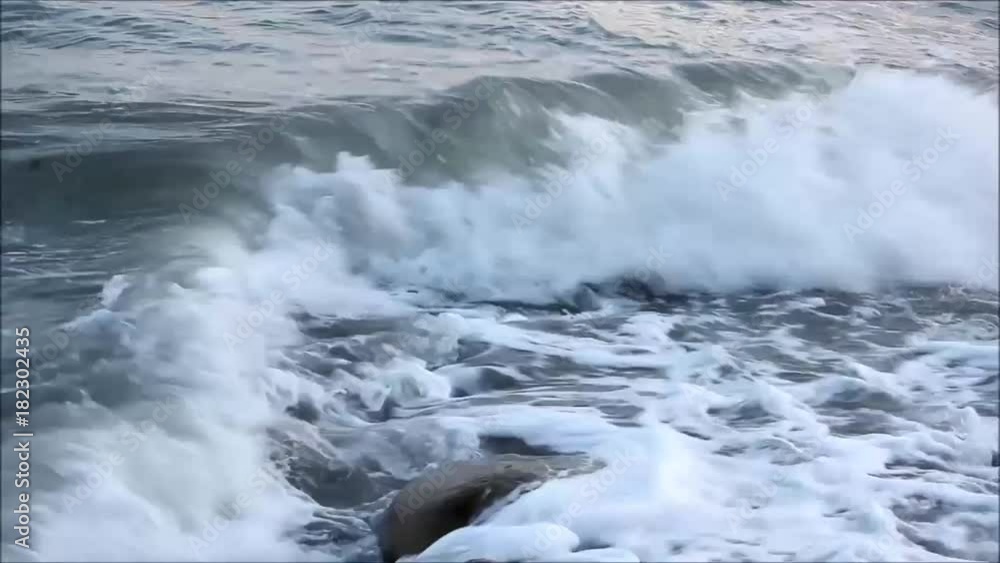 The sea waves are beating against the shore. The Black Sea, the city of Khosta, Russia, 2017 The sea waves are beating against the shore. The Black Sea, the city of Khosta, Russia, 2017