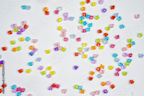 Colored beads for design on a white background