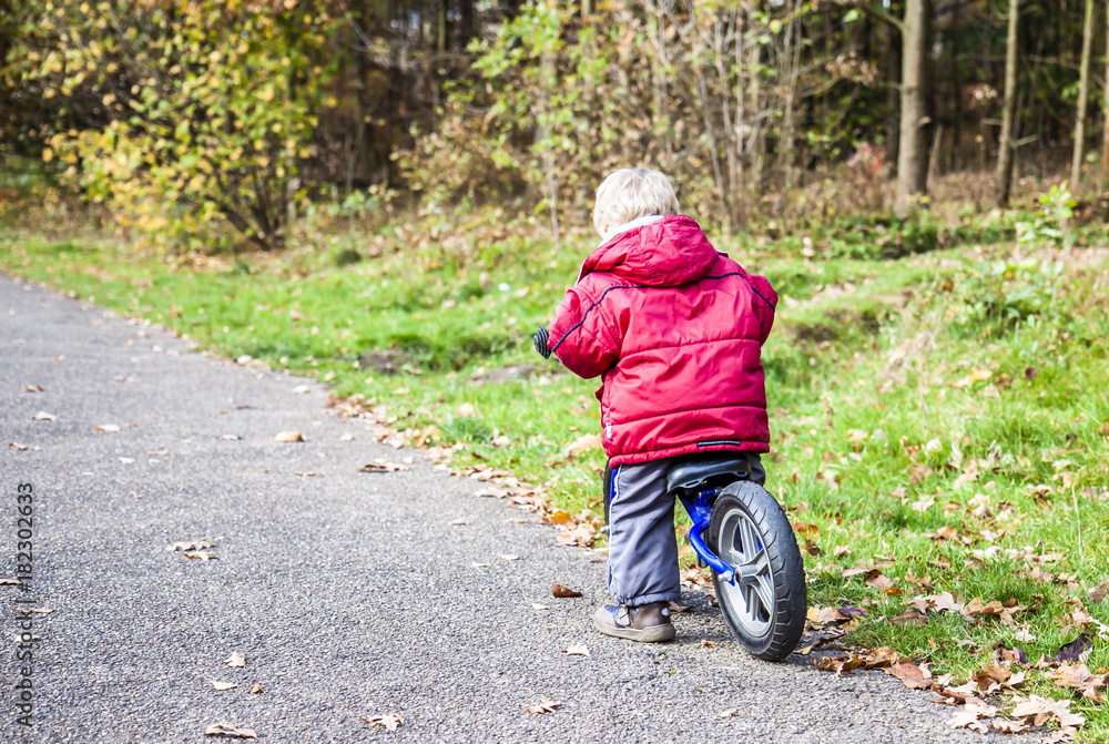 Fototapeta premium Young boy training on his bike