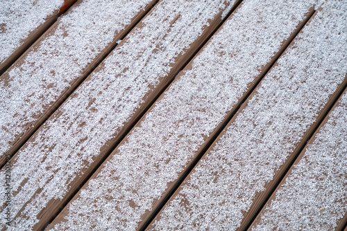 Light snow on the wooden deck