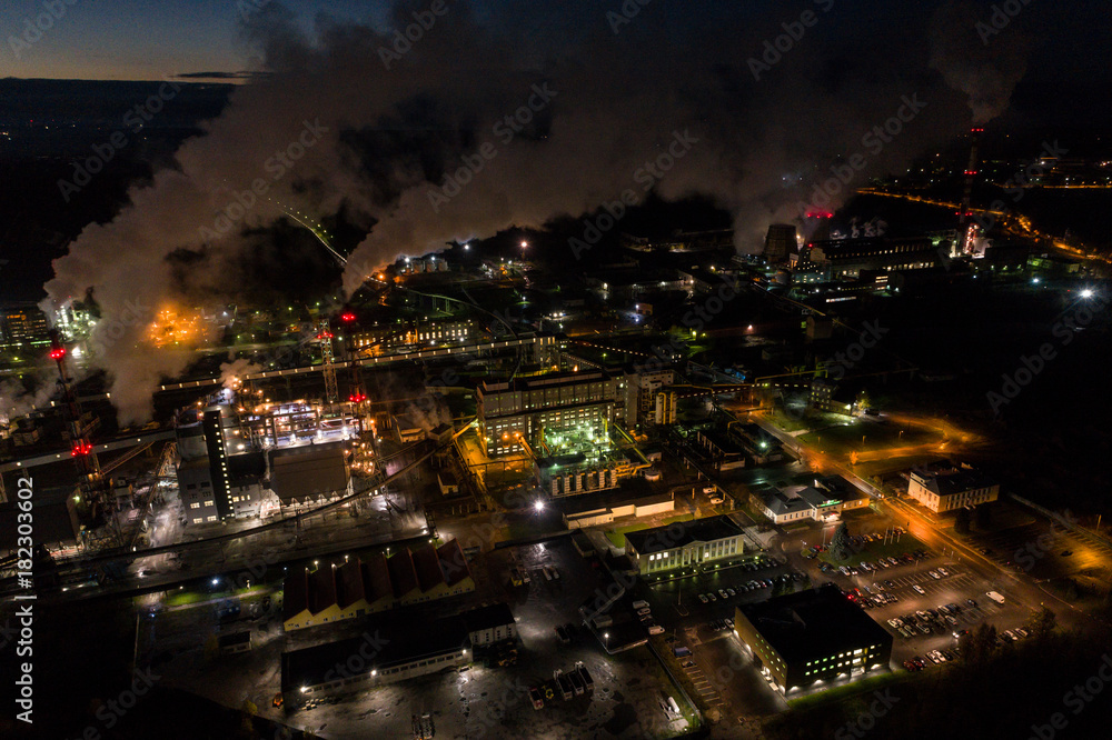 Fototapeta premium Aerial view of oil refinery. Industrial view at oil refinery plants with lots of light at night. 