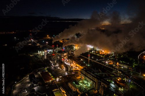 Aerial view of oil refinery. Industrial view at oil refinery plants with lots of light at night.  photo