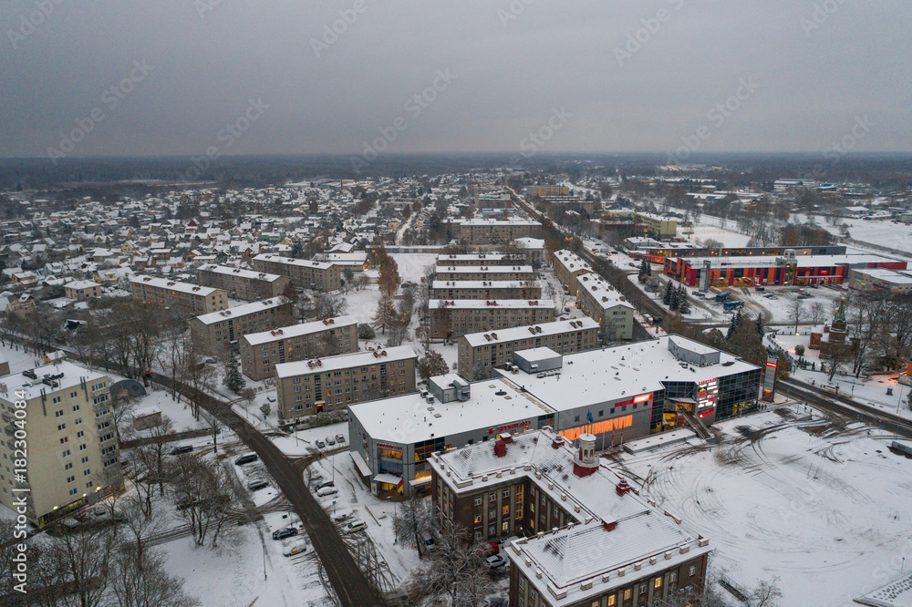 Obraz premium Aerial view of the city covered with snow.