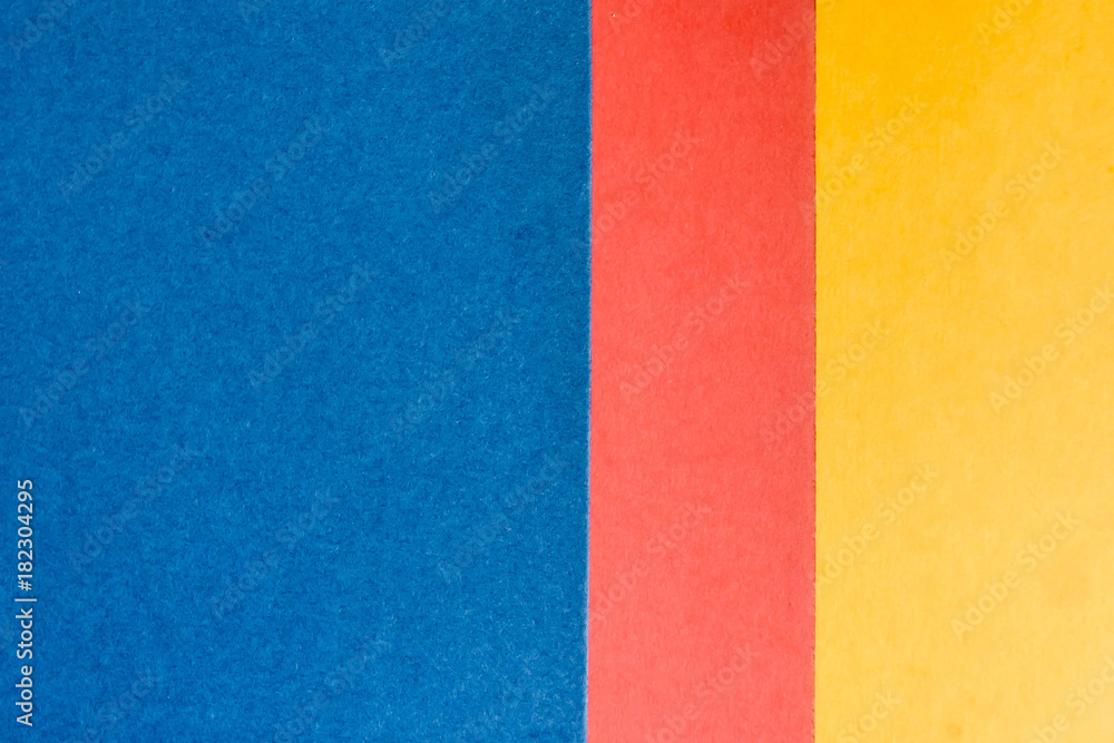 Blue, pink and yellow sheet of paper. Abstract background. Blue, pink and yellow sheet of paper. Abstract background.
