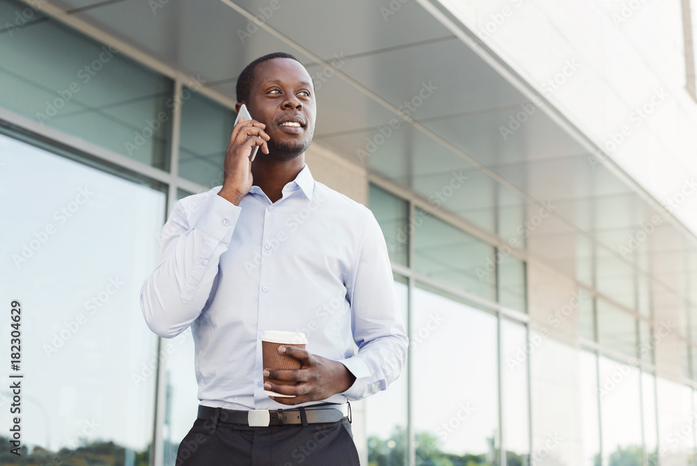 Black businessman outdoors in smart casual ware Black businessman outdoors in smart casual ware