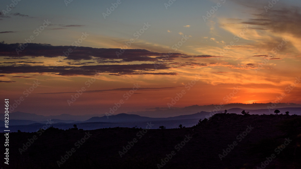 Panorama sunset with mountains and orange sky