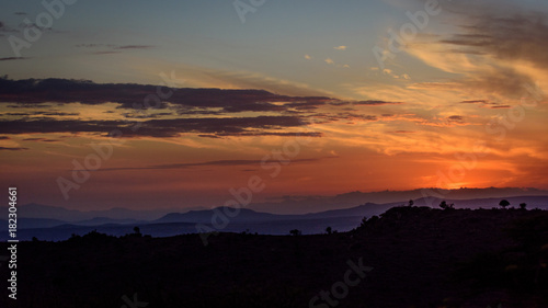 Panorama sunset with mountains and orange sky © michelle