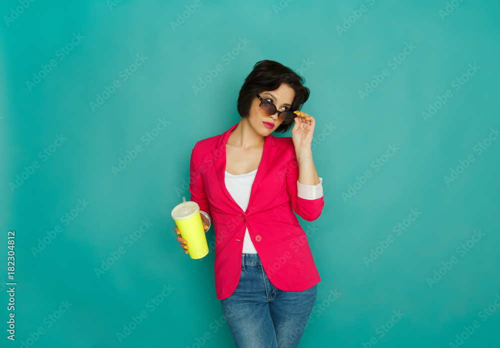 Young girl in bright casual clothing at studio background Young girl in bright casual clothing at studio background