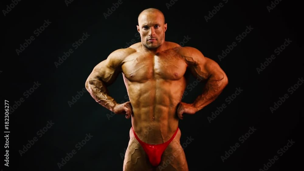 bodybuilder posing in studio bodybuilder posing in studio
