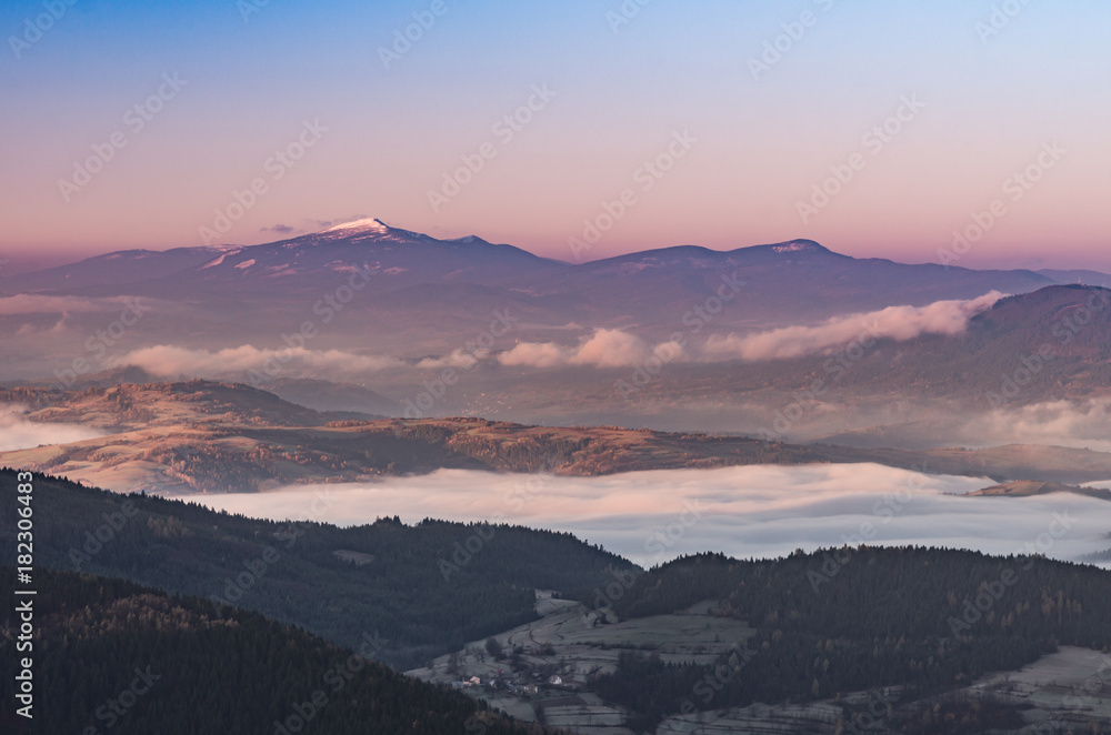 Misty mountain landscape in the morning with Babia Gora mountain, Poland
