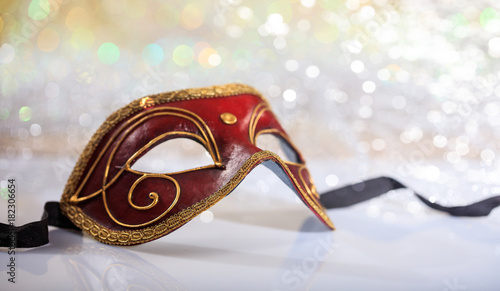 Handmade carnival mask on bokeh background