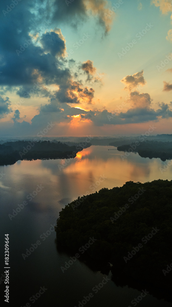 aerial shot of island in tropical lake at sunrise sri lanka