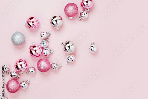 Pink Christmas balls background. Flat lay, top view
