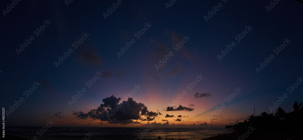 panoramic view of beautiful sunset over ocean beach