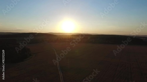 Beautiful landscape with a ride on the highway the trucks and a few cars at sunset. aerial view. Footage. photo