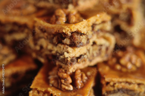 appetizing baklava with nuts and honey closeup on a wooden background