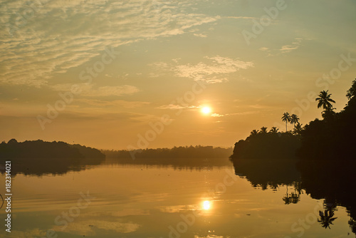 beautiful sunrise over tropical lake