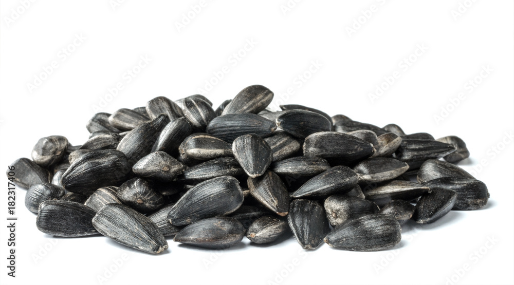 Heap of sunflower seeds isolated on the white background. Heap of sunflower seeds isolated on the white background.