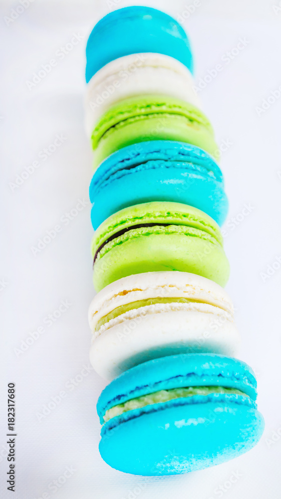 High detailed colorful macarons on white background. Flat lay. High detailed colorful macarons on white background. Flat lay.