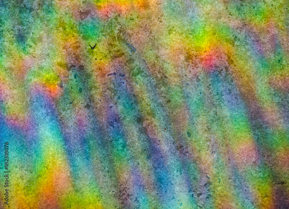 Abstract multicolored rainbow background (refraction of sun light on a stone background)