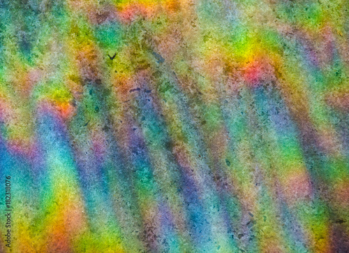 Abstract multicolored rainbow background (refraction of sun light on a stone background)