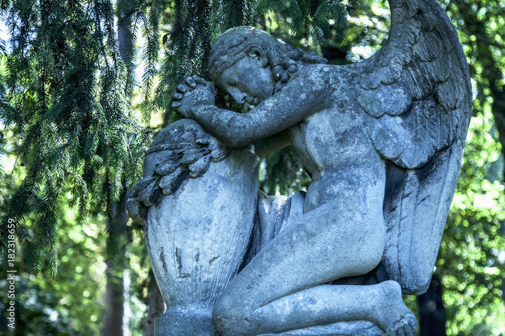 angel of death as a symbol of the end of life. Ancient statue. (Religion, eternal life, immortality, faith concept) angel of death as a symbol of the end of life. Ancient statue. (Religion, eternal life, immortality, faith concept)