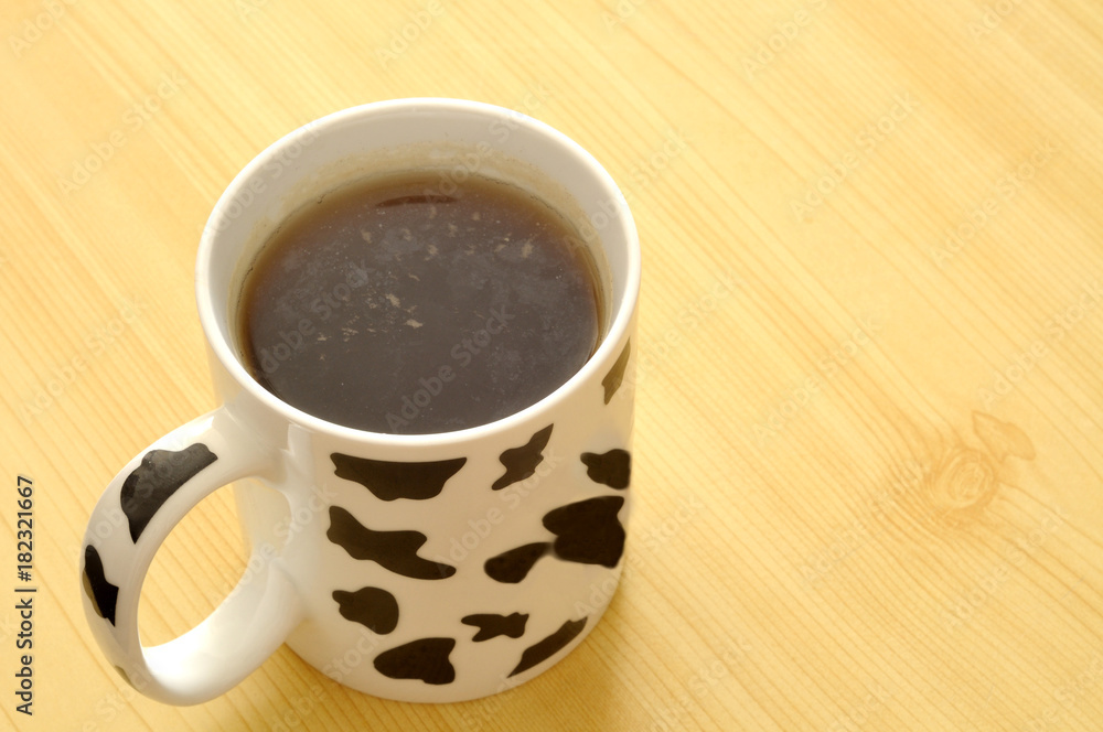 spotted cup with green tea