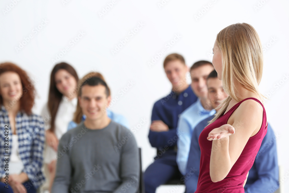 Group of people with business trainer at seminar Group of people with business trainer at seminar