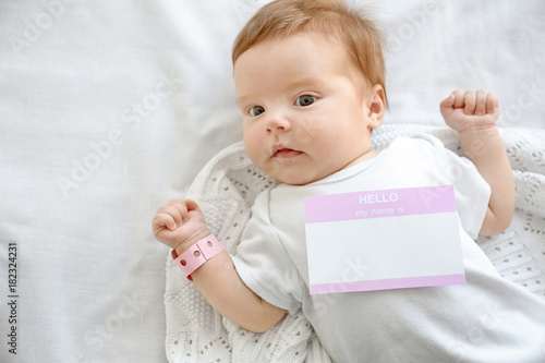 Cute baby lying on couch at...