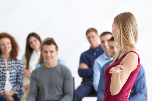 Group of people with business trainer at seminar