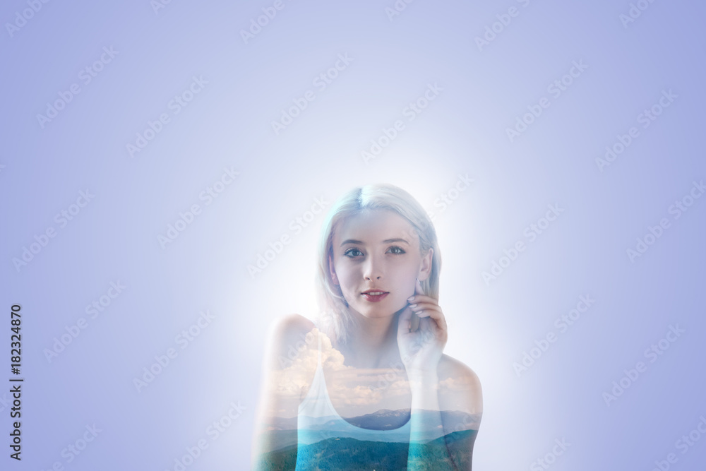 So beautiful. Pleasant attractive young woman looking in front of her and smiling while touching her cheek So beautiful. Pleasant attractive young woman looking in front of her and smiling while touching her cheek
