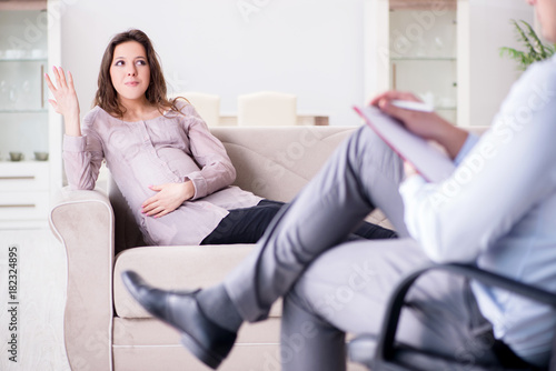 Pregnant woman visiting psychologist doctor