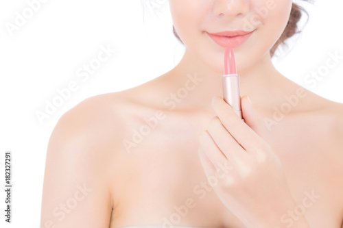 Beauty asian woman applying make up with lipstick of mouth isolated on white background  Beautiful girl on lips with happy  skincare and cosmetic concept.