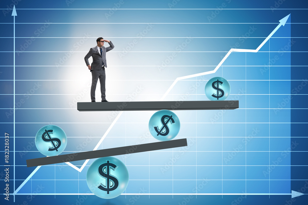Businessman balancing in financial dollar concept Businessman balancing in financial dollar concept