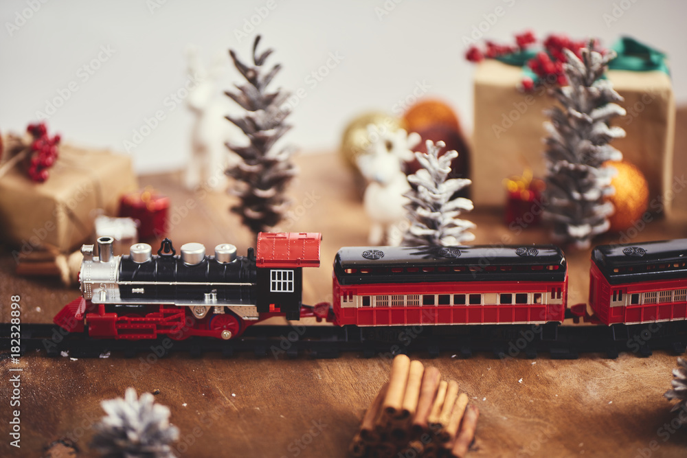 Christmas toy train with decoration, smow and lighting