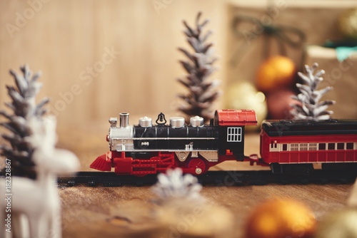 Christmas toy train with decoration, smow and lighting photo