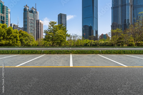 empty car park with downtown city space background