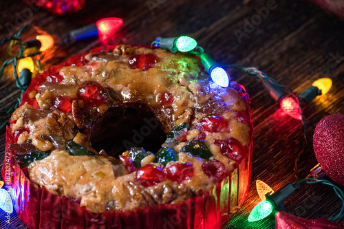 Christmas fruitcake with festive lights photo