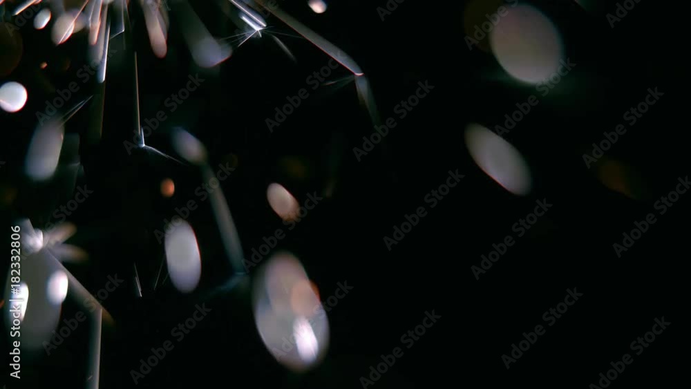 Bengal light burns with sparks. Black background. Close up Bengal light burns with sparks. Black background. Close up