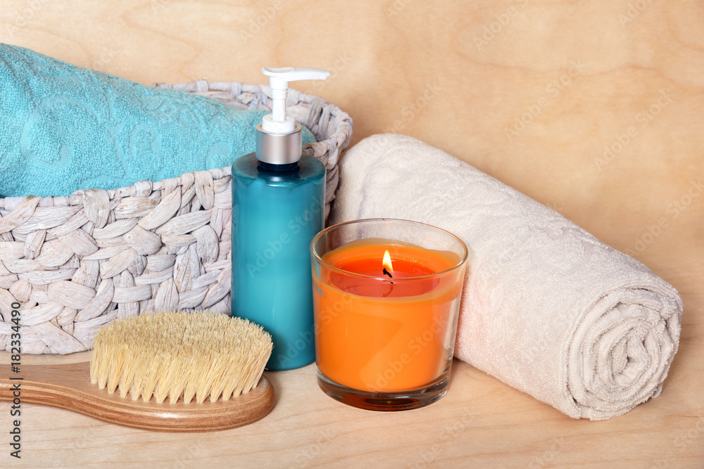 Accessories for massage. Massage brush with wooden handle, body lotion, scented candle and wicker basket with towels. The atmosphere of the Spa.
Accessories for massage. Massage brush with wooden handle, body lotion, scented candle and wicker basket with towels. The atmosphere of the Spa.