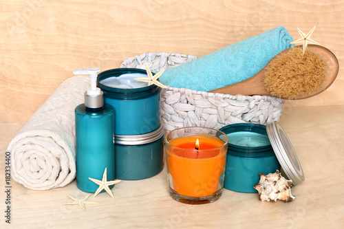 Bath accessories and beauty products with sea minerals and algae. All thalassotherapy. Body wrap, body lotion, scrub, cream, massage brush with wooden handle and a couple of towels in the basket. © flannet