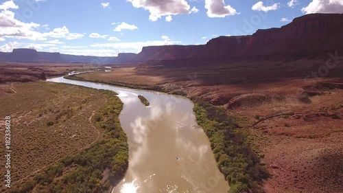 Aerial amazing shot of rafting boats on a calm desert river in utah